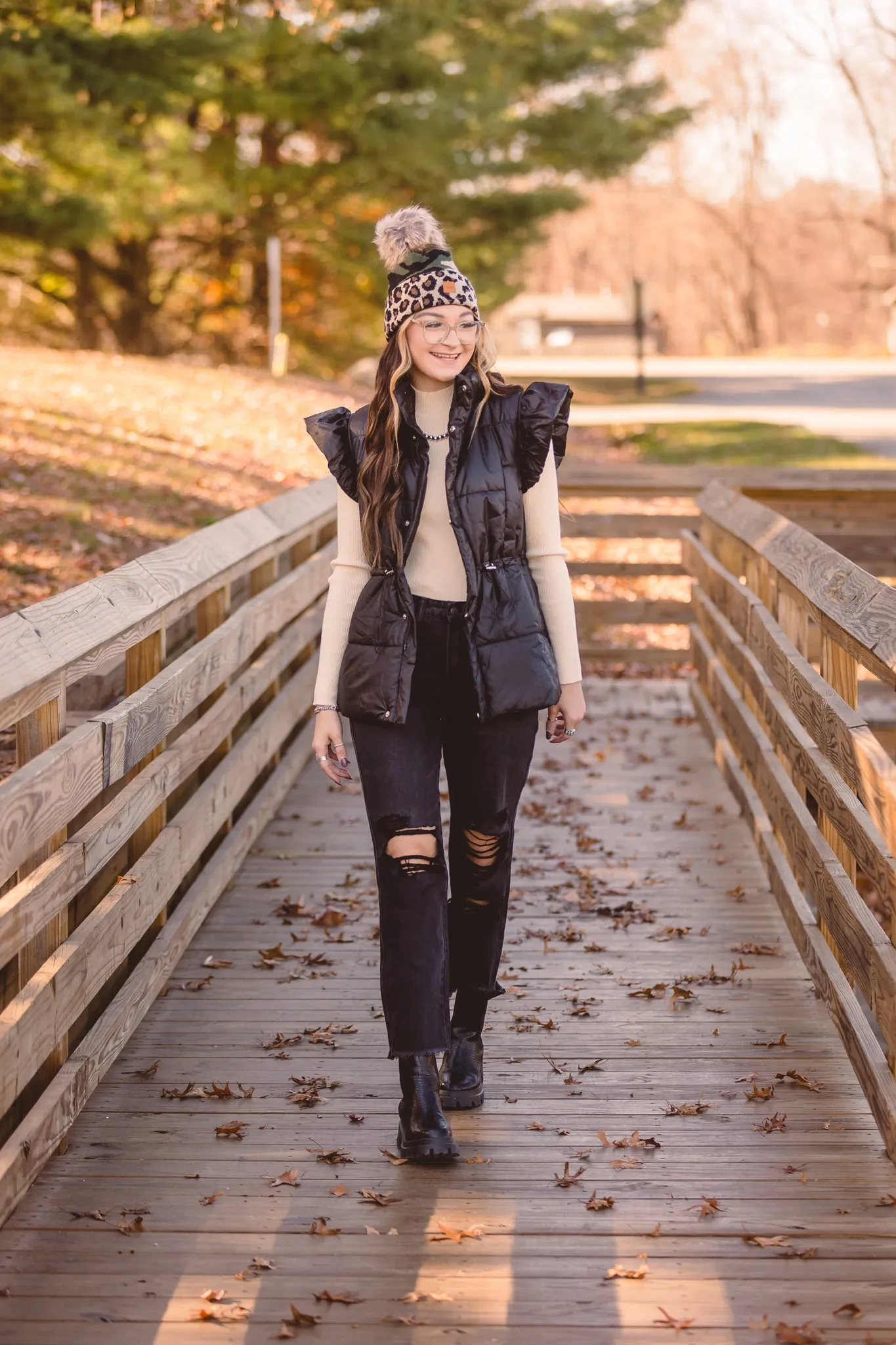 Black Puffer Vest with Shoulder Ruffle Detail