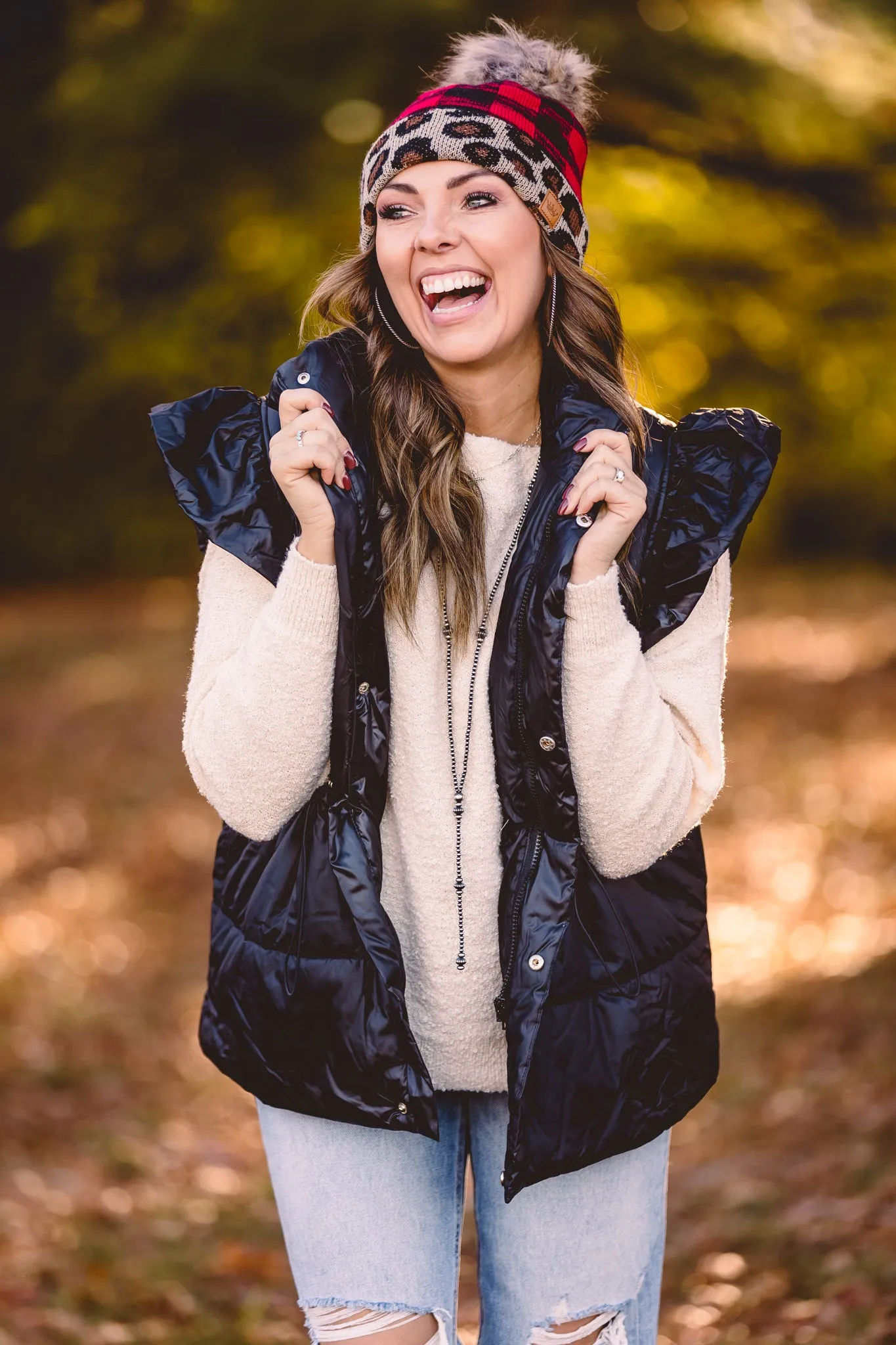 Black Puffer Vest with Shoulder Ruffle Detail