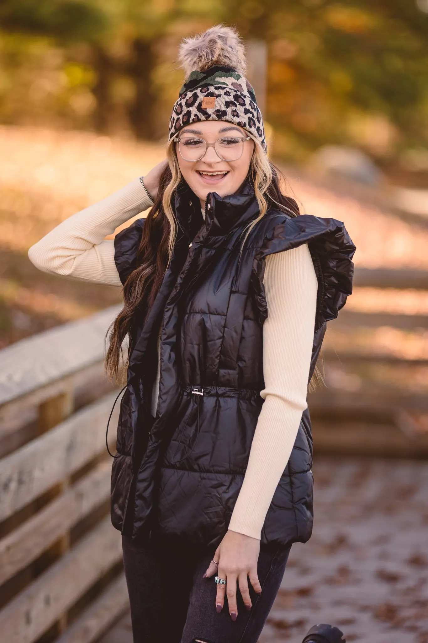 Black Puffer Vest with Shoulder Ruffle Detail