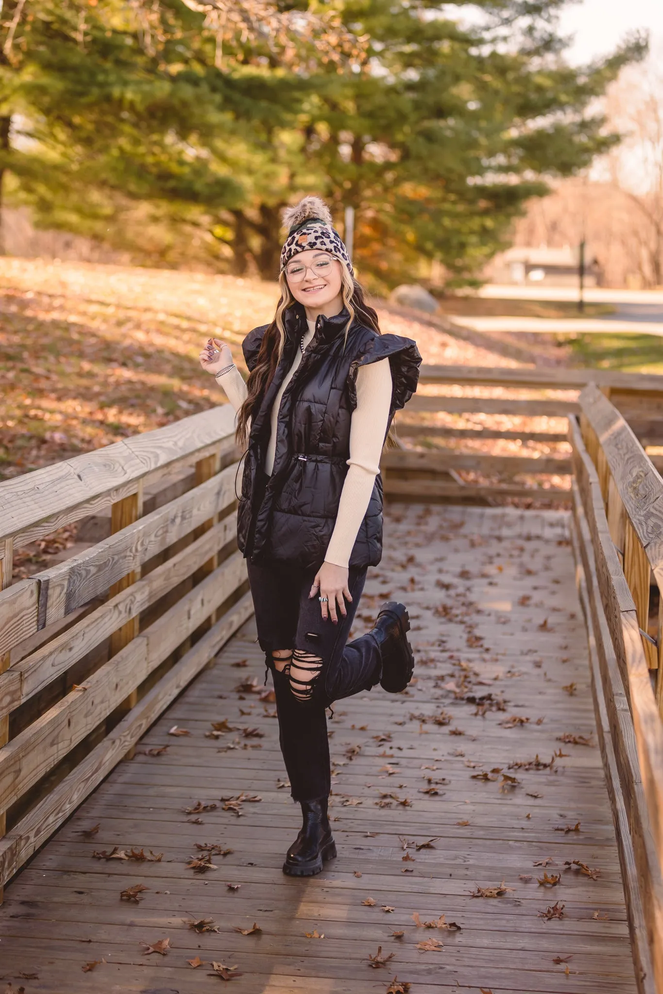 Black Puffer Vest with Shoulder Ruffle Detail
