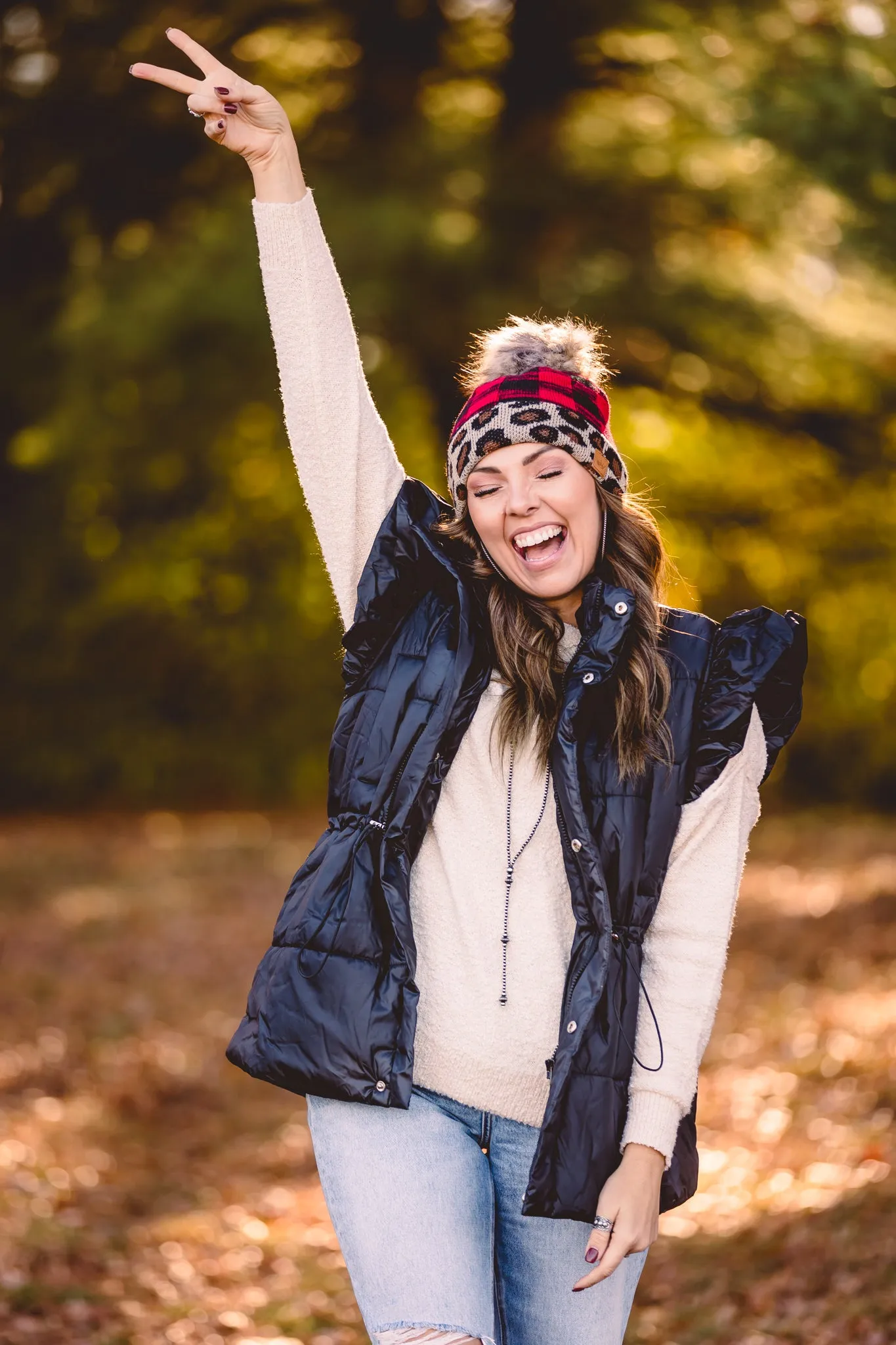 Black Puffer Vest with Shoulder Ruffle Detail