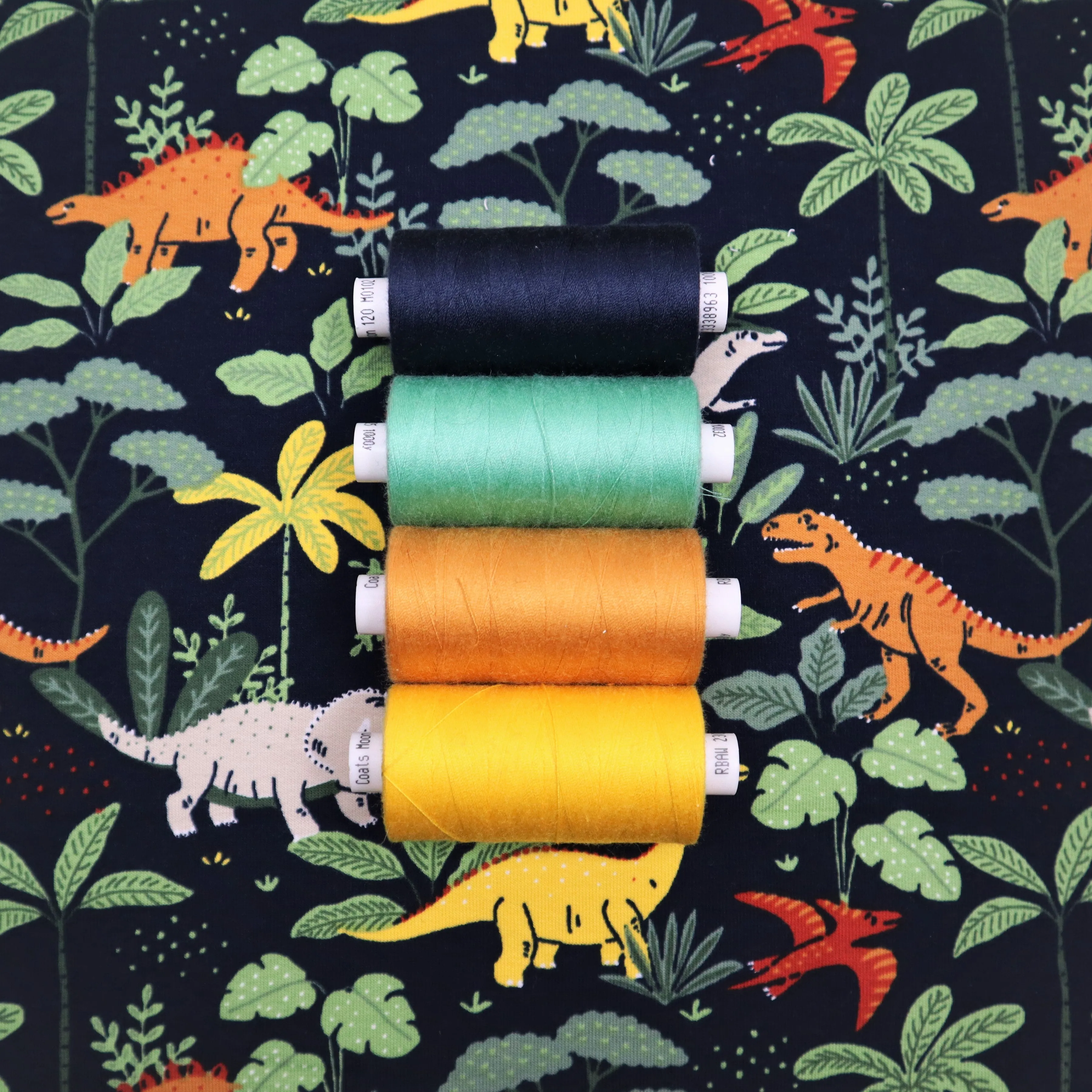 End of Roll Rem Organic French Terry in Navy Dinosaur Print