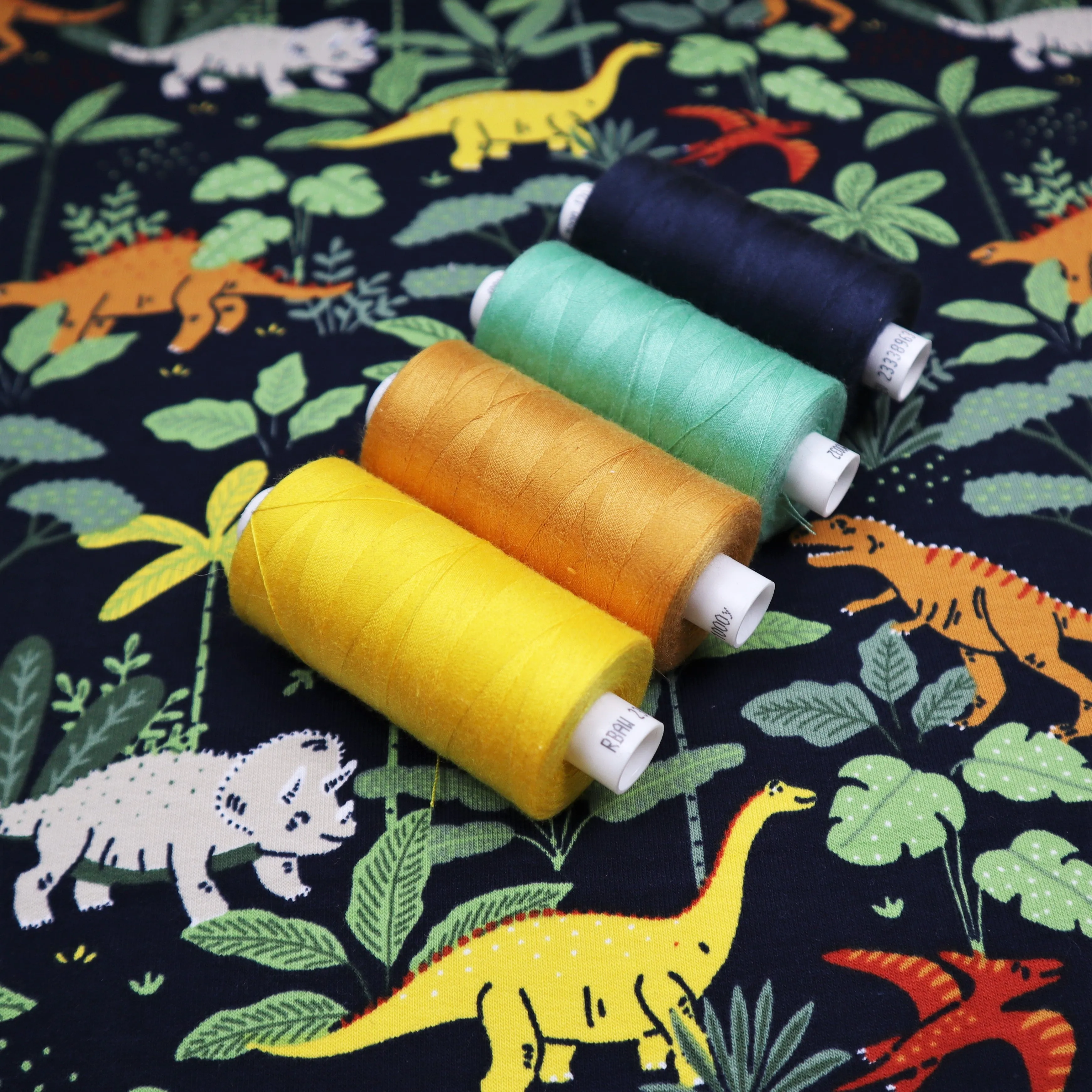End of Roll Rem Organic French Terry in Navy Dinosaur Print